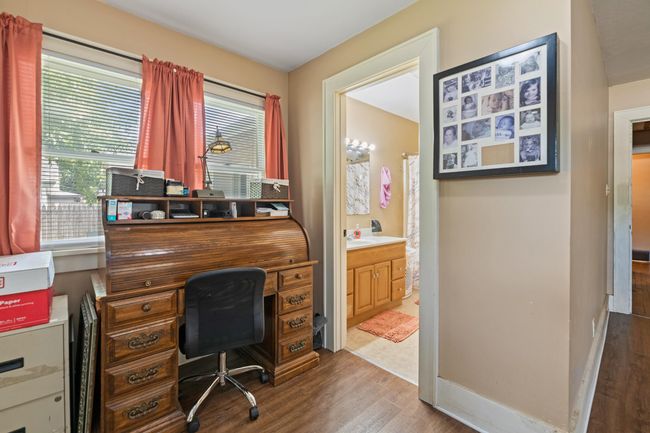 Office space featuring wood finished floors and baseboards | Image 12