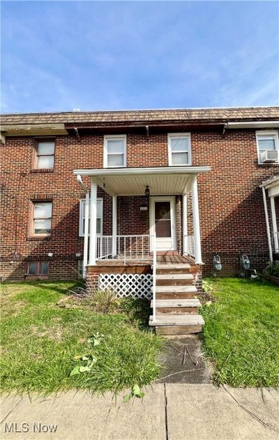 View of front of home featuring a porch and a front lawn | Image 1