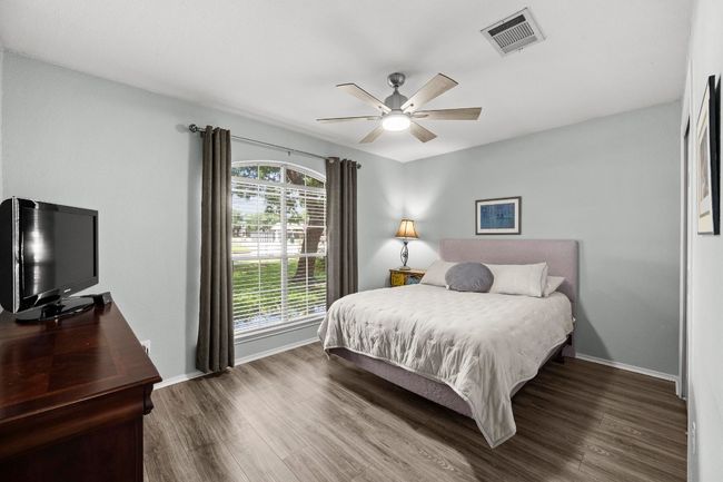 Bedroom with LVP floors, and a ceiling fan | Image 19