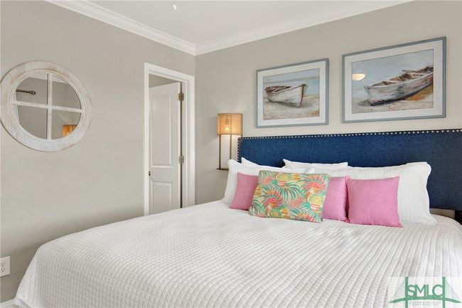 Primary Bedroom with En-Suite Bathroom & Sliding Glass Door leading to Spacious Balcony with Pool View | Image 21