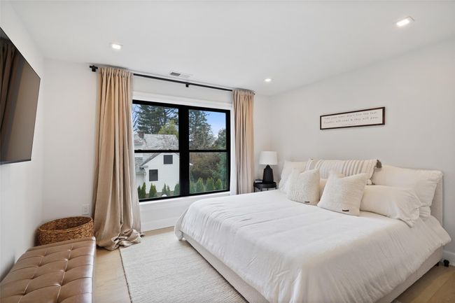 Bedroom featuring wood finished floors | Image 25