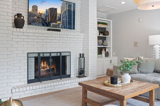 Living room features custom book shelving | Image 8