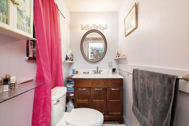 Bathroom featuring toilet and vanity | Image 18