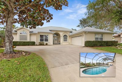 Pool home with oversized driveway. | Image 1