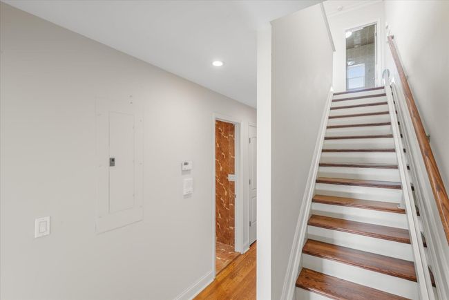 Staircase featuring wood finished floors and recessed lighting | Image 8