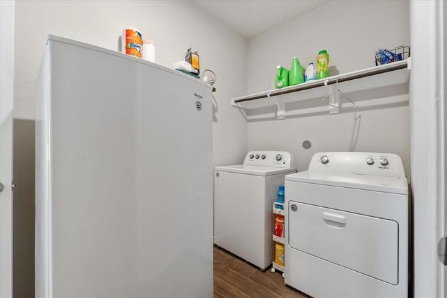Laundry room located off the kitchen. Freezer is not staying with the home. | Image 15
