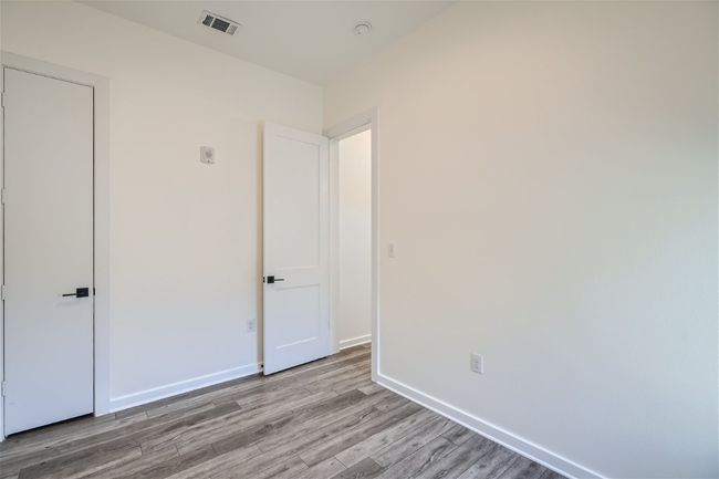 The downstairs bedroom makes for a great home office for guest suite! | Image 11