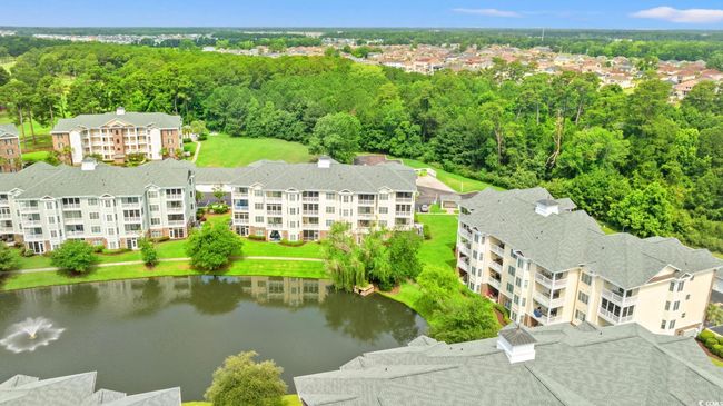 Drone / aerial view of a large body of water and apartment complex | Image 31