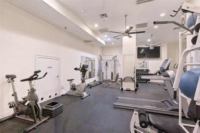 Workout area with recessed lighting and visible vents | Image 16