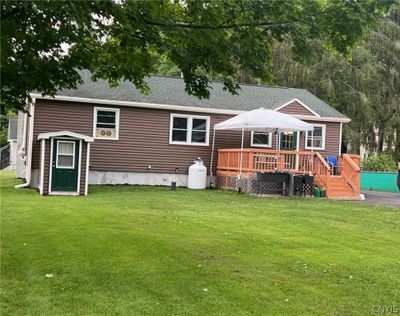 back view of home with nice deck | Image 2