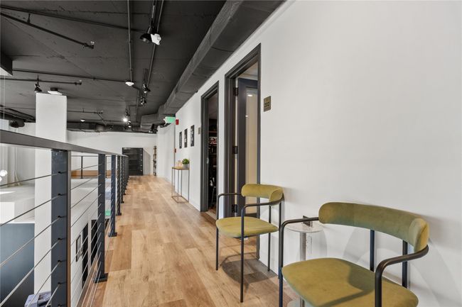 Hall with rail lighting and wood finished floors | Image 8