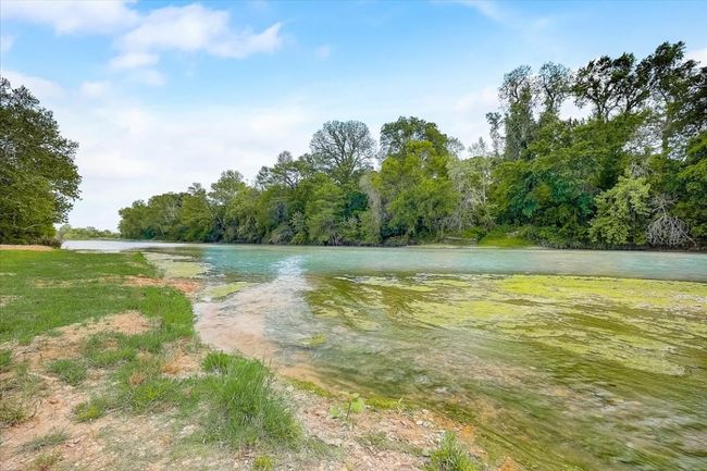 Property view of water featuring a wooded view | Image 24