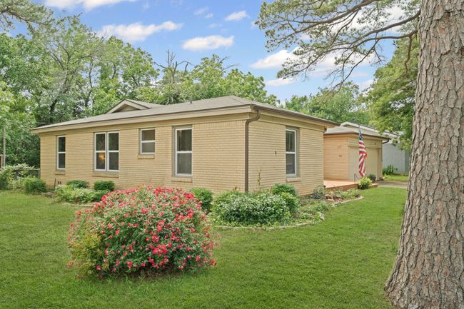 View of side of home featuring a lawn | Image 4