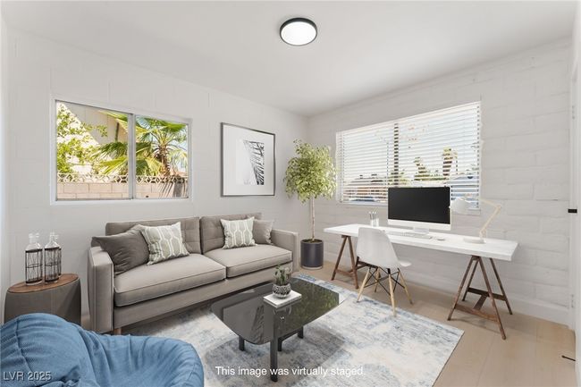 Living room with an office area and healthy amount of natural light | Image 36