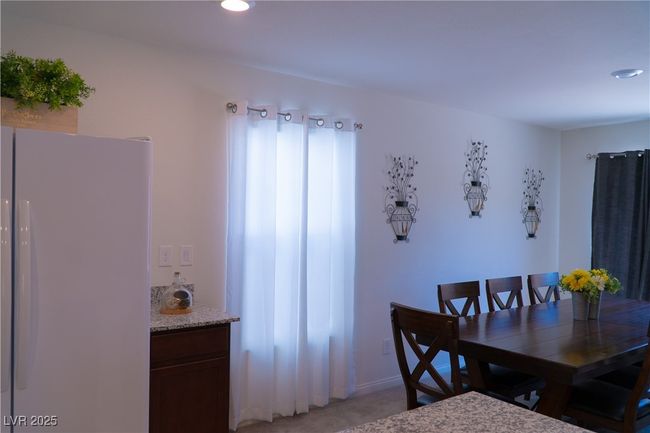 Dining area with recessed lighting and light colored carpet | Image 26