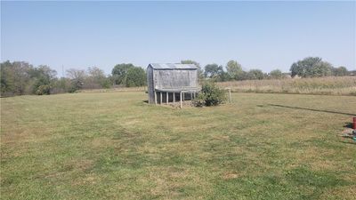 View of back yard featuring a majestic rural view and an outdoor structure | Image 3