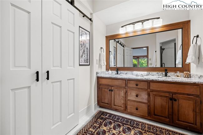 Primary bath with doors to 2nd closet | Image 20