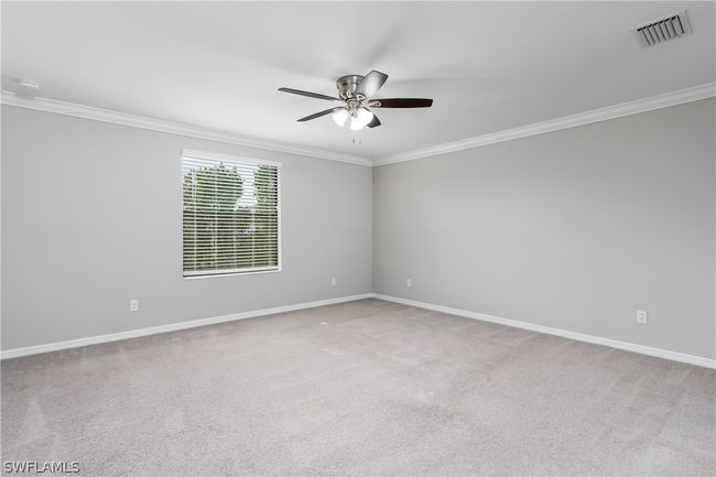 Carpeted empty room with ornamental molding and ceiling fan | Image 21