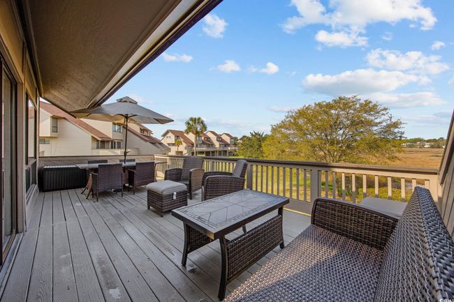 Deck featuring march view and an outdoor hangout area | Image 28
