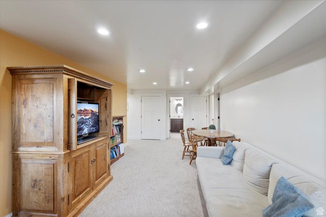 Living room featuring recessed lighting, baseboards, and light carpet | Image 28