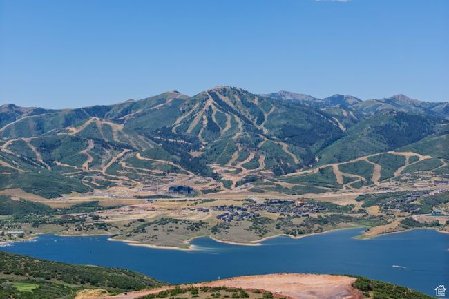 View of mountain background featuring a large body of water | Image 14