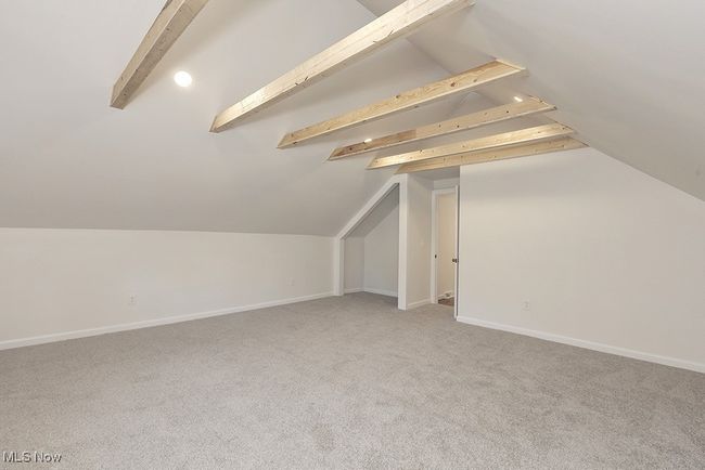 Bonus room featuring carpet flooring and vaulted ceiling | Image 36