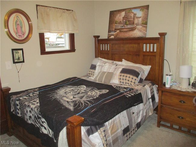 Bedroom featuring light colored carpet | Image 26