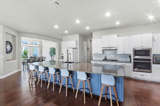 Kitchen featuring a large island | Image 9