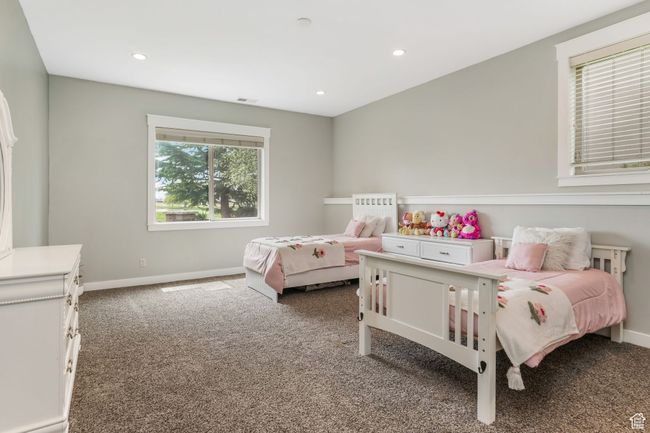 Carpeted bedroom with baseboards, visible vents, and recessed lighting | Image 24