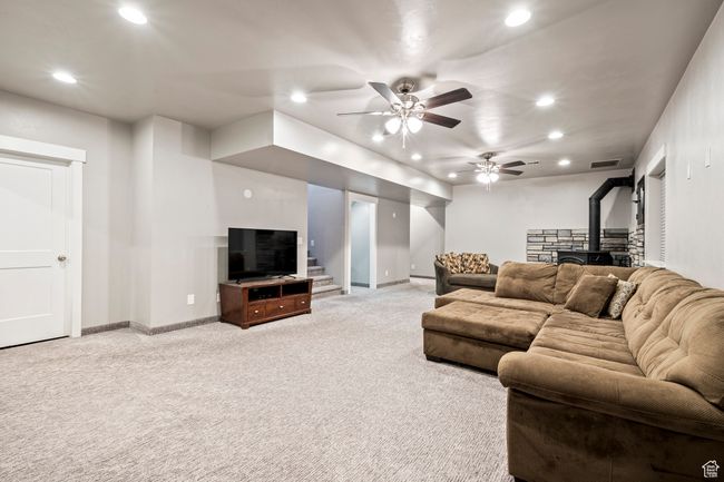 Living area with light carpet, recessed lighting, visible vents, and a ceiling fan | Image 36