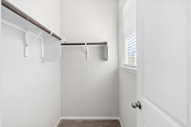 Spacious closet featuring carpet floors | Image 22