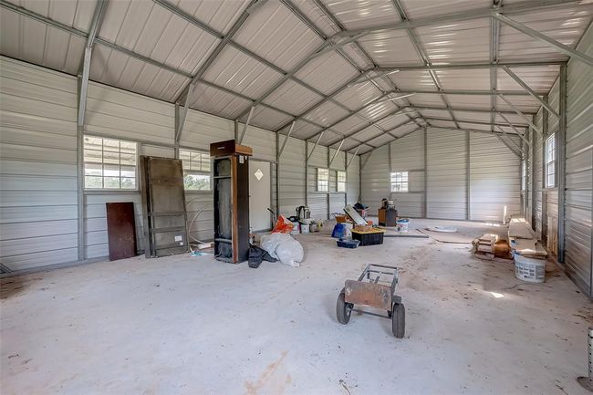 Inside, the bones are set. Doors and windows are in place, and the open layout awaits your personal blueprint. This is a blank slate with a head start. | Image 32