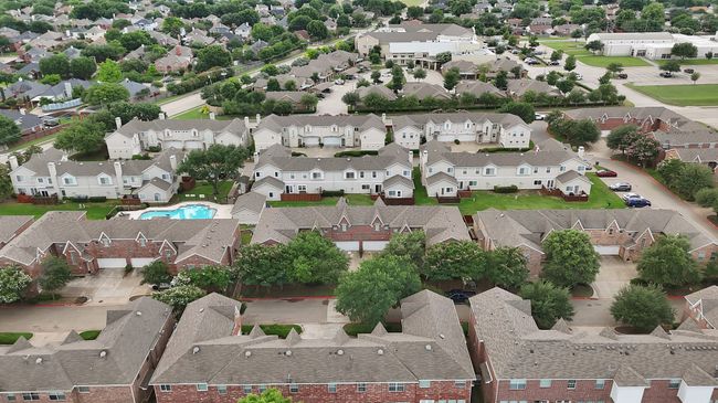 Aerial perspective of suburban area featuring a pool area | Image 5
