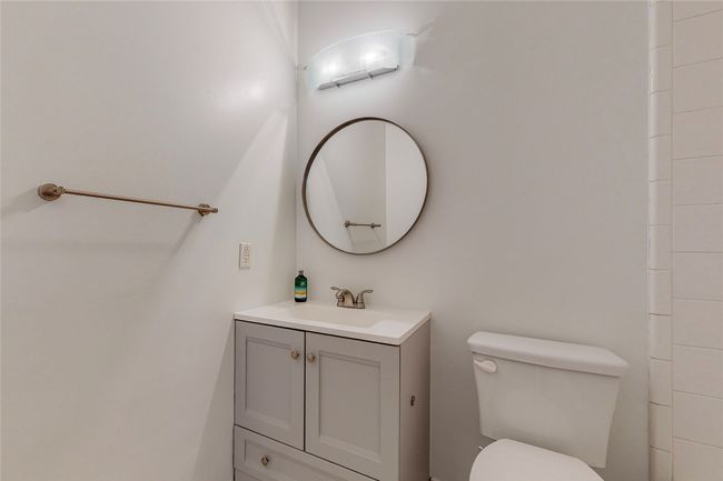 Bathroom featuring vanity and toilet | Image 32