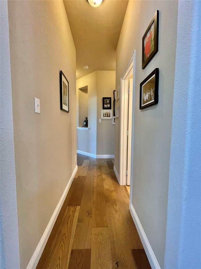Hall featuring hardwood / wood-style floors and baseboards | Image 26