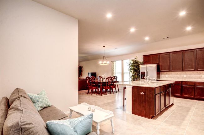 A sitting area off the kitchen is a nice space for the kiddos to be able to hang out while you're working in the kitchen. | Image 8