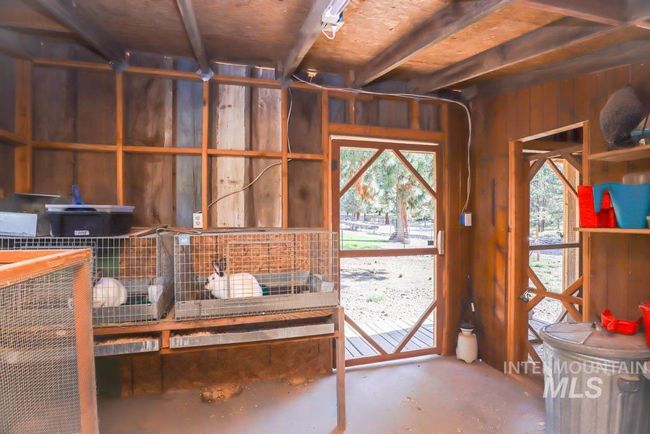 Misc room with unfinished concrete flooring | Image 45