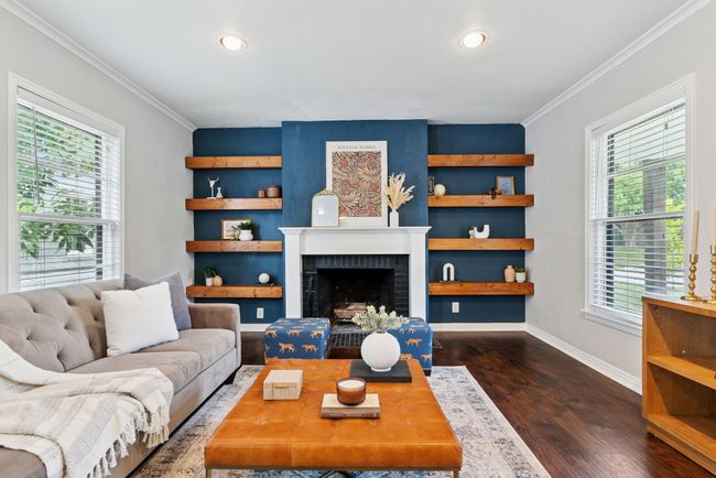 No, this isn't Pinterest - it's just a fabulous accent wall with floating shelves and fireplace in this darling home. | Image 5