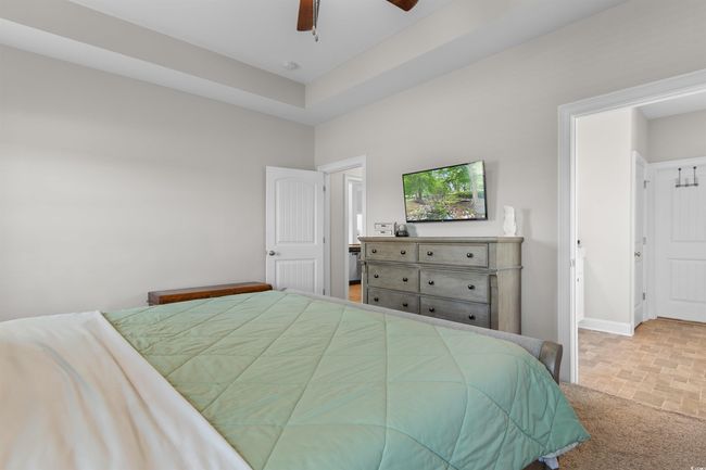 Bedroom with stone finish flooring and a ceiling fan | Image 16