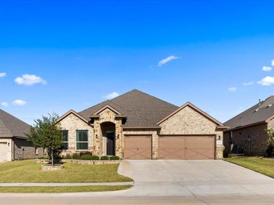 View of front of house featuring a front yard and a garage | Image 1