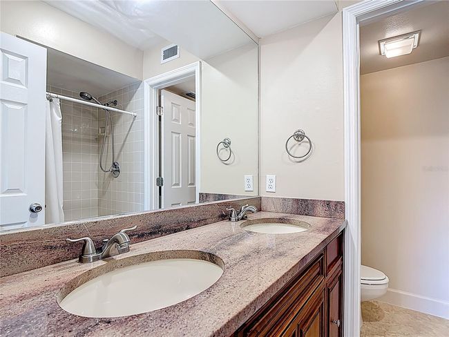 Primary bathroom with double sinks & walk in shower | Image 23