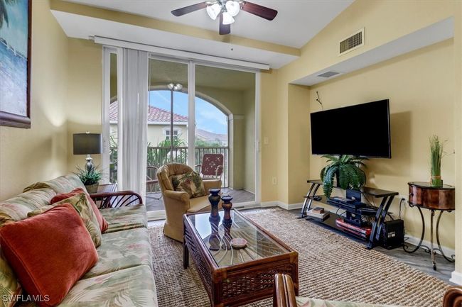 Living area featuring a ceiling fan and baseboards | Image 4