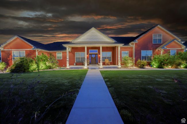 View of front of property featuring covered porch and a front lawn | Image 108