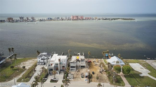 Aerial overview of property's location with a large body of water | Image 36