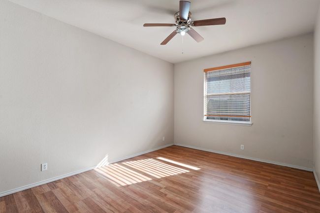 Third bedroom with ceiling fan | Image 28