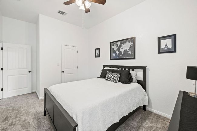 Bedroom with carpet and ceiling fan | Image 22