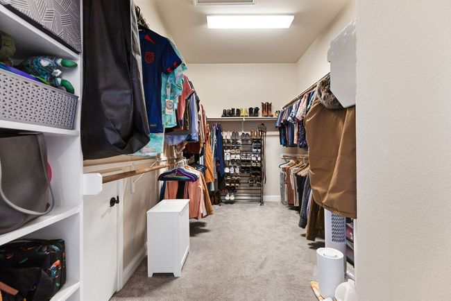 A walk-in closet so deep that nobody has to fight for space. | Image 23