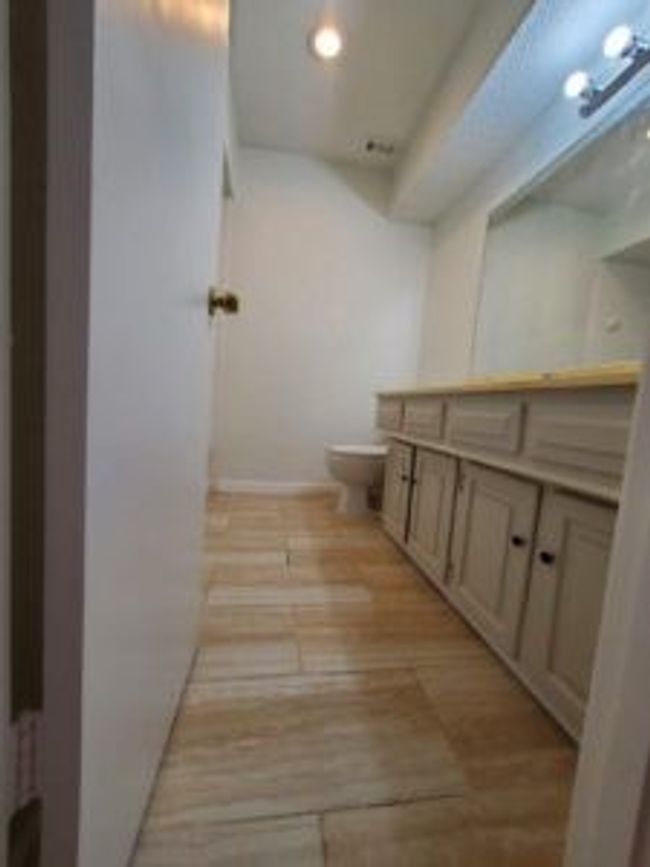 Bathroom featuring vanity and wood finished floors | Image 33