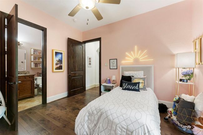 Downstairs second bedroom with ensuite bath and large walk-in closet | Image 23