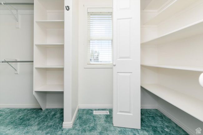 Walk in closet featuring carpet flooring | Image 31